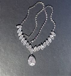 "Chunky CZ Teardrop Necklace , CZ Necklace , Clear Marquise Shaped CZ, CZ Statement Necklace , Silver Chain Necklace                                                                                                                                   Full of Sparkle and dazzling   Silver Necklace is 20\" long / half way down the silver necklace is Marquise Shaped CZ stones and then a Pear shaped CZ which hangs 1 1/4\" . Beautiful Statement Necklace ! Please ask any questions as I do not accept returns! Thank You  I do offer discounts when buying multiple items"