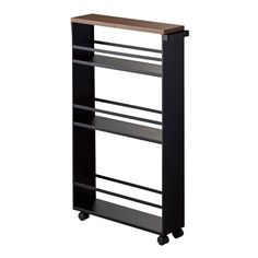 a black bookcase with three shelves on wheels