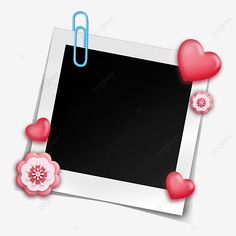 an open photo frame with hearts and paper clip