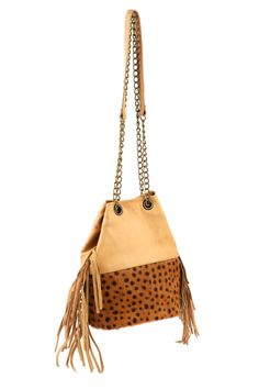 This fringe leather bucket bag is a stylish addition to any outfit. It includes an inner pocket for storing keys, phone, and other must-haves. The strap can be adjusted to wear it as a crossbody. (PRODUCT INFO): Size: 9.5" H x 10" W inches Strap length: 49" inches Handle Drop: 19" inches Strap: Adjustable Length-Chain + Leather Material: Cow leather + Genuine Calf Hair Leather Lining: Suede (SHIPPING INFO): All our items are made-to-order, therefore please allow 3-5 business days for production. Sustainable Shopping, Fringe Bags, Leather Bucket Bag, Leather Bucket, Leather Fringe, Calf Hair, Leather Chain, Leather Material, Cow Leather