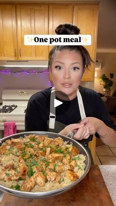 a woman with an apron holding a pan of food in front of her face and the words one pot meal above her head