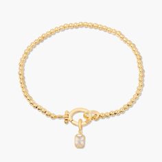 Treat your wrists to some bling with the Mackenzie Birthstone Bracelet. With a vivid birthstone charm, and intricately-beaded gold, this sparkling accessory is sure to add a touch of glam to any outfit. Avery Bracelet: Available in 14k gold plated or rhodium plated brass, 6" bead bracelet, hinge closure measures 1/2", 4mm beads Mackenzie Hinge Birthstone Charm: Available in 14k gold plated sterling silver or rhodium plated sterling silver1/8"x1/4" charm, 5mm Cubic Zirconia NOTE - open bracelet h Dainty Gold Bracelet With Sparkling Stones, Dainty Gold Bracelets With Sparkling Stones, Adjustable Gold Beaded Bracelets With Stones, Gold Bracelet With Cubic Zirconia Jewels, Gold Bracelets With Jewels And Cubic Zirconia, Elegant Gold Cubic Zirconia Beaded Bracelets, Adjustable Gold Bracelets With Sparkling Stones, Gold Charm Bracelet With Jewels For Gift, Gold Beaded Bracelets With Stones