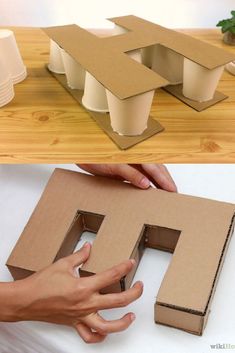 someone is making a house out of cardboard and then it's made into a letter