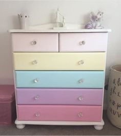 a multicolored chest of drawers in a child's room