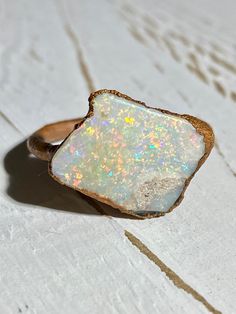 Beautiful electroformed Raw Australian opal ring using recycled copper Vibrant, twinkling full of red + multi coloured fire with a section of natural sandstone on the opal face A genuine natural opal (not a doublet, triplet, inlay or synthetic opal) Stone size: 17.7 x 13.8 mm   Direct from an opal mining family :) Size: 5 1/2 US The one you see is the one you will receive Thanks for looking! Caring for electroformed jewellery: Due to the nature of its creation electroformed jewellery is not as r Raw Opal Ring, Australian Opal Ring, Ring Opal, Raw Opal, Electroformed Jewelry, Synthetic Opal, Australian Opal, Opal Ring, Natural Opal