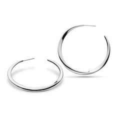 These sterling silver hoop earrings measure 45mm. Solid in design they hang elegantly with faceted curves to draw the light at all angles. These contemporary earrings are simply timeless. Contemporary Silver Round Hoop Earrings, Silver Round Hoop Earrings Contemporary Style, Contemporary Silver Small Hoop Earrings, Small Silver Contemporary Hoop Earrings, Contemporary Small Silver Hoop Earrings, Modern Sterling Silver Hoop Earrings, Modern Sterling Silver Earrings With Shiny Finish, Modern Sterling Silver Round Hoop Earrings, Minimalist Curved Jewelry With Polished Finish