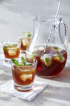 pitcher and glasses filled with iced tea on a table