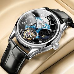 Tourbillon Watches.Movement: CAL.027.16Model: 8003Drive: single spring drivePower storage: 50 (hours)Vibration frequency: 21600 (times/hour)Chain up mode: automatic chain upCase diameter: 42mmCase thickness: 13.3mmBand width: 22mmMaterial: 316L fine steelMaterial: Italian calf leatherWaterproof depth: 50m waterproofMirror surface: artificial sapphireBuckle: folding buckleCrown: Straight-in type Luxury Black Automatic Watch, Modern Black Automatic Watch, Formal Automatic Watch Accessories With Rectangular Dial, Elegant Automatic Chronograph Watch For Business, Timeless Black Watch With Round Dial, Timeless Black Watch Accessories With Round Dial, Elegant Black Watch With Rectangular Dial, Automatic Business Watch Accessories, Black Watches With Subdials