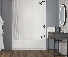 a bathroom with gray walls and wood flooring