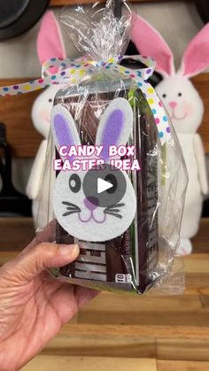 someone holding up a candy box with bunny ears on it