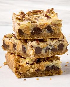 three pieces of chocolate chip cookie bars stacked on top of each other