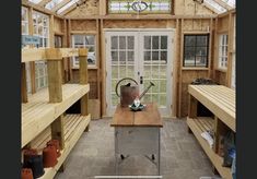 a room filled with lots of wooden shelves and windows