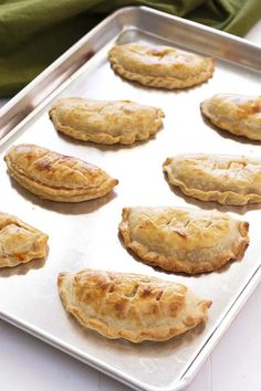 several pastries on a baking tray ready to be baked