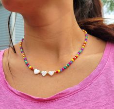 Multicolor Beaded Choker necklace  Beautiful delicate necklace great to wear on summertime, festival, party, vacation, holiday, banquet, beach or everyday wear. ▪️These cute necklaces are made with 3mm multicolor glass beads, 18k gold brass spacer beads, nylon cord 0.5mm, Shell. ▪️ Size: 17 inches long. ▪️All orders go inside a box already prepared as a gift. ▪️100% handmade items. ▪️It is not recommended to contact the jewelry with soap, lotions, perfume or any other harmful chemicals to use it Trendy Heart-shaped Summer Necklace, Heart Shaped Necklaces For Summer Gifts, Heart-shaped Summer Necklaces Perfect As Gifts, Colorful Heart Beads Necklaces For Festivals, Colorful Heart Beads Necklace For Festivals, Heart Beads Necklace For Beach, Multicolor Heart Beads Jewelry For Vacation, Colorful Festival Necklaces With Heart Beads, White Heart-shaped Jewelry For Summer