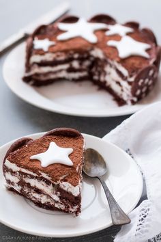 two white plates topped with slices of cake