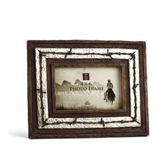 an old photo frame with a cowboy on the front and bottom, is shown against a white background