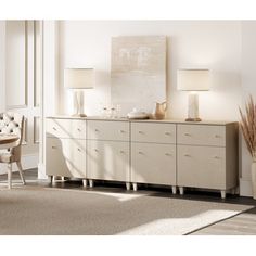 a living room scene with focus on the sideboard and chair, vases and lamp