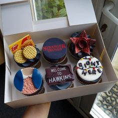 cupcakes in a box with the words welcome hawks on them