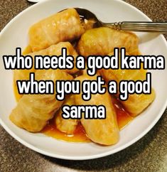 a white plate topped with dumplings covered in sauce and the words who needs a good karma when you got a good samma