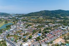 an aerial view of a small town surrounded by mountains