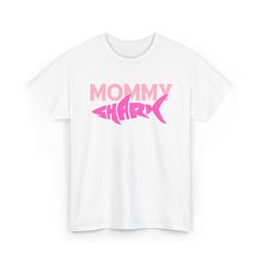 Show your shark family pride with this Mommy Shark T-Shirt! Whether you're jamming to the catchy 'Baby Shark' tune or simply looking for a fun, family-themed shirt, this tee is perfect for you. Material: 100% Cotton Fit: Regular fit Sizes: S, M, L, XL, 2XL, 3XL, 4XL, 5XL Colors: Available in various colors  Care Instructions: Wash separately before wearing to avoid bleeding issues. Machine wash cold with like colors, tumble dry low Baby Shark Shirt, Mommy Shark, Shark Family, Shark Shirt, Shark T Shirt, Color Care, Baby Shark, Family Shirts, Gift For Mom