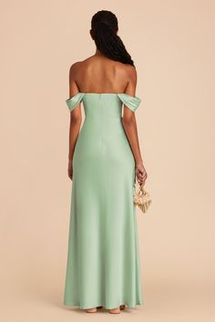 the back of a woman wearing a mint green bridesmaid dress with an off - shoulder