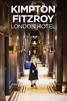 a woman is walking down the hallway in front of a hotel sign that reads kimpton fizroy london hotel