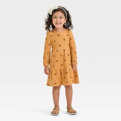 Get your darling ready for the day in cozy style by dressing them in this Cozy Dress from Cat & Jack™. This long-sleeve dress features a tiered design with a textured for sweet style. Plus, it comes with side pocket to help keep their hands warm while providing extra space for small items. Made from cotton-recycled polyester blend fabric with lining and added spandex, this pullover-style dress offers them comfortable all-day wear. Cat & Jack™: Designed for all children so you can trust it's made Playful Long Sleeve Dresses For Fall, Cozy Dress, Cozy Style, Long Sleeve Knit Dress, Long Sleeve Print Dress, Long Sleeve Floral Dress, Sweet Style, Tier Skirt, Toddler Girl Outfits