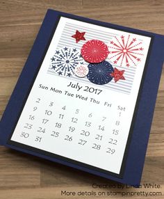 a july calendar with fireworks and stars on it