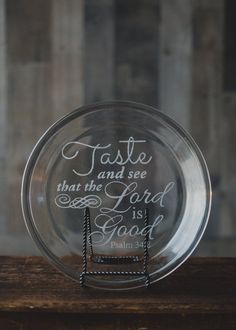 a glass plate with the words taste and see that the lord is good on it