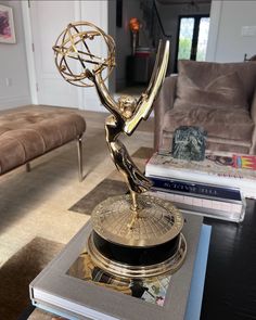 an award sitting on top of a table in a living room