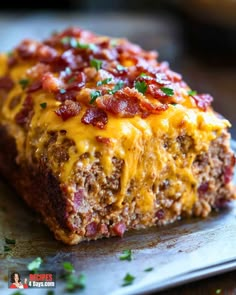 a piece of meatloaf with cheese and bacon