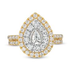 a yellow and white diamond ring with two rows of diamonds on the band, set in 18k gold