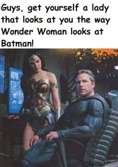 a man and woman sitting next to each other in front of a computer screen with the caption'guys, get yourself a lady that looks at you the way wonder woman looks