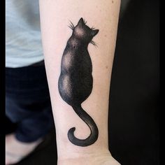 a black cat tattoo on the wrist