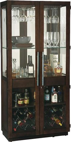 a wooden cabinet filled with lots of bottles and glasses