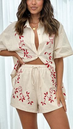 Embrace effortless style with this relaxed fit, collared shirt set. Featuring red embroidered details, functional buttons, and short sleeves, this set is perfect for any occasion. Cheap Casual Embroidered Sets, Luxury Red Printed Sets, Luxury Cotton Sets With Buttons, Button Up And Shorts, High Waist Fashion, Embroidered Details, Linen Set, Red Button, Swimwear Cover