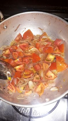 the food is being cooked in the pan on the stove top and ready to be eaten