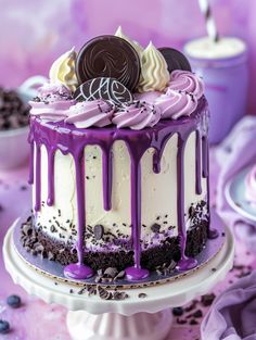 a cake with purple icing and oreo cookies on top is sitting on a plate