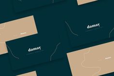 four business cards with the word damar written in white on dark green background,