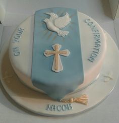 a cake that has a cross and dove on it