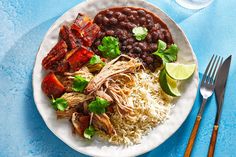 a white plate topped with rice and beans