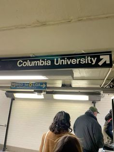 people standing in line at the columbia university subway