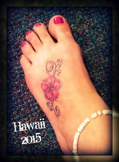 a woman's foot with a flower tattoo on her left foot and the words hawaii 2013 written below it