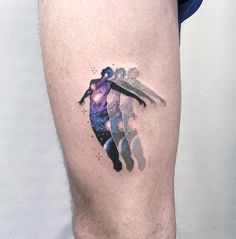 a man's leg with a tattoo on it that has an image of a basketball player