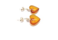 Materials: Sterling Silver 925, Real baltic amberBaltic Amber Cognac Color Heart Shape Silver Stud EarringsBaltic amber cognac color heart shape stud earrings, with 925 sterling silver.IMPORTANT!!!The image and color of the product may differ slightly from the real stone due to the composition and natural properties of the stones.Supplied in a tight envelope without a box. Yellow Heart Earrings For Gift, Yellow Heart-shaped Earrings For Gift, Heart-shaped Hallmarked Earrings For Gift, Yellow Heart-shaped Sterling Silver Jewelry, Amber Heart, Color Heart, Cognac Color, Earrings Heart, Amber Earrings