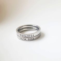 Name Date Ring Stacking  Wedding Date Ring Birth date Stackable Ring Staking Ring Bridesmaid Ring Kid Rings Mommy Ring Family  Personalized Wedding Date Birth date Ring Name Ring Stackable Ring Staking Ring Bridesmaid Ring Kid Rings Mommy Ring Family  Personalize your ring with a name OR a date OR initials. 3mm stainless steel ring hand stamped letter by letter. The listing is for one ring. Personalization can only be done on the outside of the ring. All Personalization details must be provided Kid Rings, Wedding Ring With Name, Aquamarine Engagement Ring Vintage, Date Ring, Bridesmaid Ring, Word Ring, Stamped Ring, Bridesmaid Rings, Stackable Rings Wedding