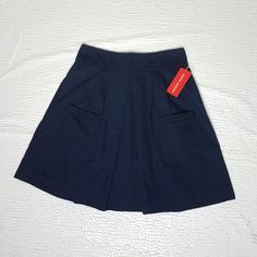 Pleated Navy Blue Skirt With Banded Waist And Two Front Functional Pockets. Hook And Closure. Casual Flared Skirt For School, Blue Casual Pleated Skirt With Pockets, Casual Blue Pleated Skirt With Pockets, School Flared Skirt With Lining, Casual A-line Pleated Skirt With Pockets, Summer School Uniform Style Lined Skirt, Lined Skirt For School, Fitted Blue A-line Pleated Skirt, Navy Pleated Skort