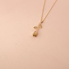 Our 14K Solid Gold Rose Necklace is a testament to timeless beauty and romantic elegance. This exquisite necklace features a rose flower pendant, elegantly crafted and sized at 4.6mm by 24.5mm. Whether you choose the classic appeal of Gold, the gentle allure of Rose Gold, or the modern touch of White Gold, each variant adds a unique charm to the necklace. The skinny cable chain, with a thickness of 0.89 mm, offers an adjustable length of 16" to 18", providing versatility and comfort for various Delicate Rose Flower Shaped Jewelry, Elegant Rose-colored Floral Jewelry, Dainty Rose-colored Flower-shaped Jewelry, Dainty Rose-colored Jewelry With Rose Design, Rose Gold Jewelry With Roses For Formal Occasions, Elegant Roses Shaped Jewelry, Delicate Rose Jewelry For Anniversary, Elegant Yellow Gold Jewelry With Rose Design, Elegant Rose Jewelry For Mother's Day