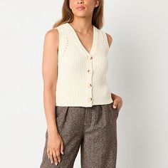 This trendy ribbed cotton-knit women's vest from a.n.a is a versatile piece for your everyday wardrobe. It has a v-neckline and a button-front that layers effortlessly over a t-shirt or style it alone with high-rise cargo pants.Closure Type: ButtonFit: Modern FitNeckline: V NeckSleeve Length: SleevelessApparel Length: 22 InchesFiber Content: 60% Cotton, 40% AcrylicFabric Description: KnitCare: Machine Wash, Tumble DryCountry of Origin: Imported Cream Sweater Outfit, Small Sweater, Sweater Vest Women, Cream Sweater, Womens Vest, Everyday Wardrobe, Sweater Vest, Vneck Sweater, Sweater Outfits